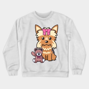 Cute Yorkshire terrier holds a teddy bear Crewneck Sweatshirt